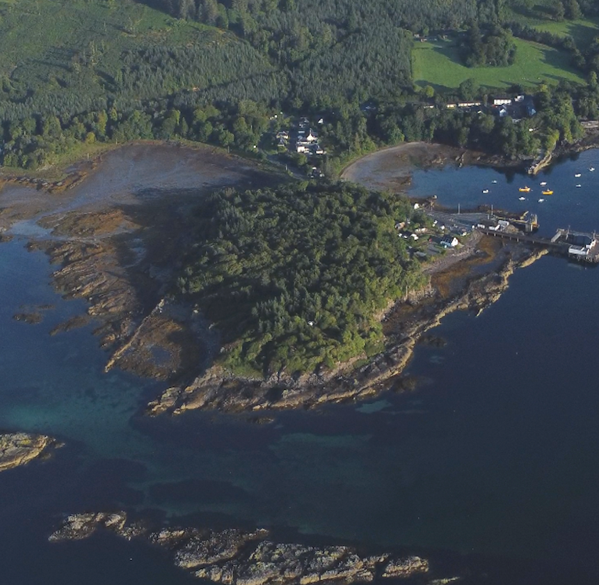 Aerial drone view of Rubha Phoil eco holiday retreat on the Isle of Skye, surrounded by forest and sea
