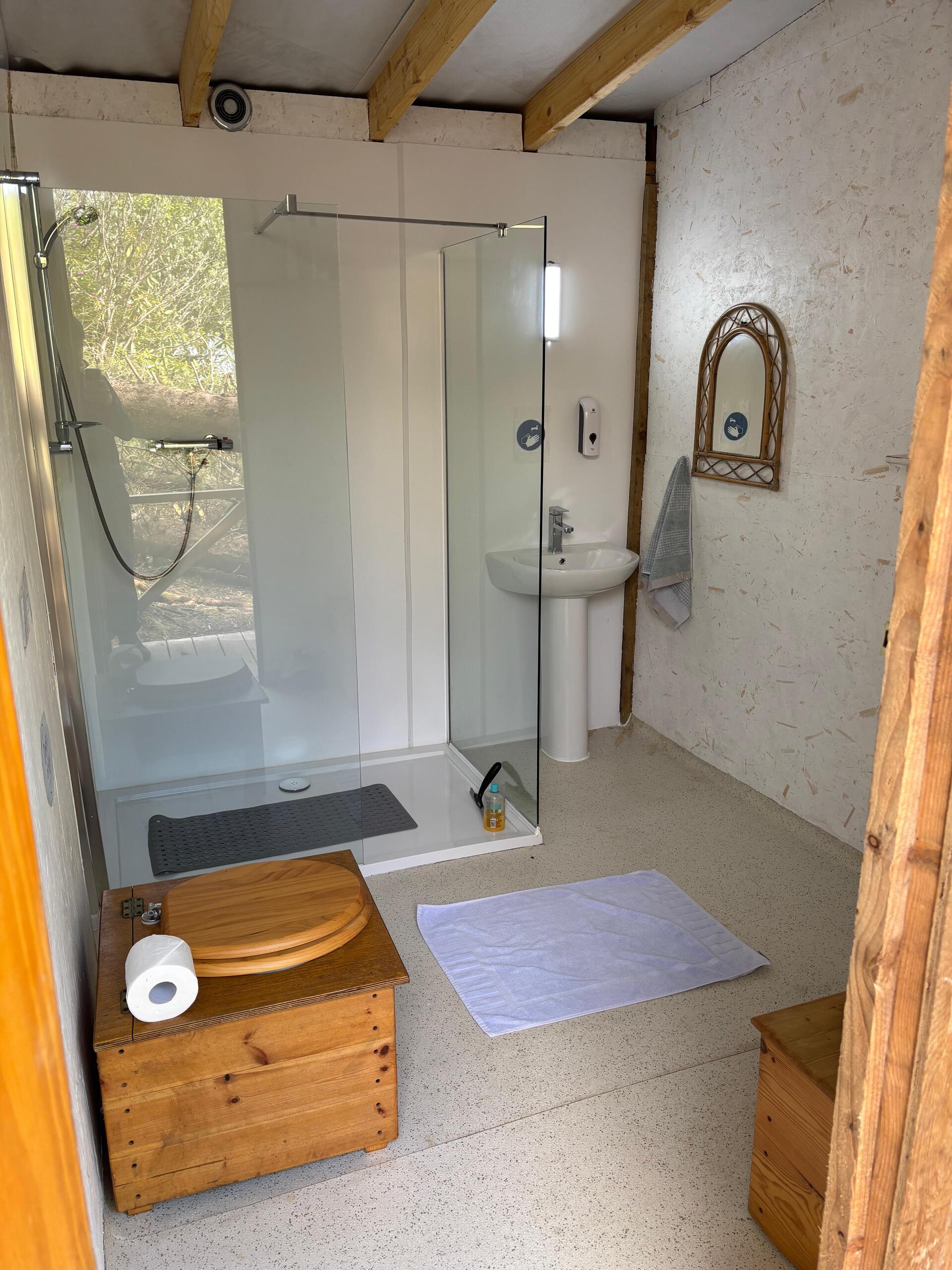 Private, spacious hot water shower at Rubha Phoil permaculture project on the Isle of Skye, ideal for families and kept clean and well-maintained
